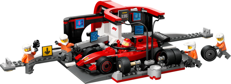 Zastávka v boxech F1 a personál's vozem Ferrari